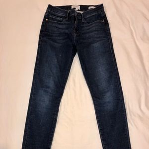 FRAME skinny ankle jeans w/ staggered raw hem, 27